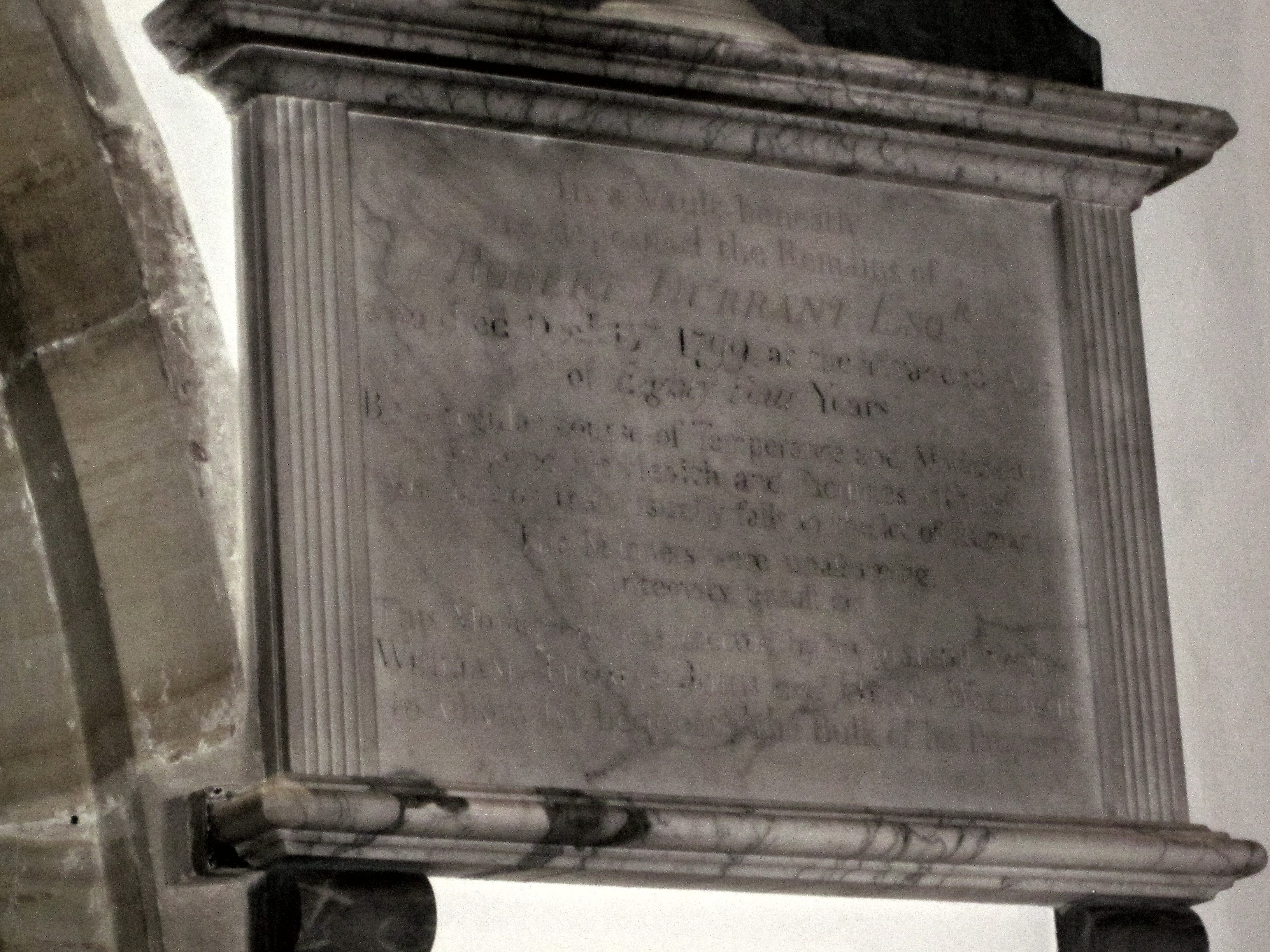 In a vault beneath are deposited the Remains of Robert Durrant, Esq., who died December 13th, 1799, at the advanced age of 84 years. By a regular course of temperance and moderation, he enjoyed his health and faculties with less interruption than usually falls to the lot of humanity.
His manners were unassuming ; his integrity unsullied. This monument was erected by his grateful nephews William, Thomas, John, and Henry Woodward, to whom he bequeathed the bulk of his property.